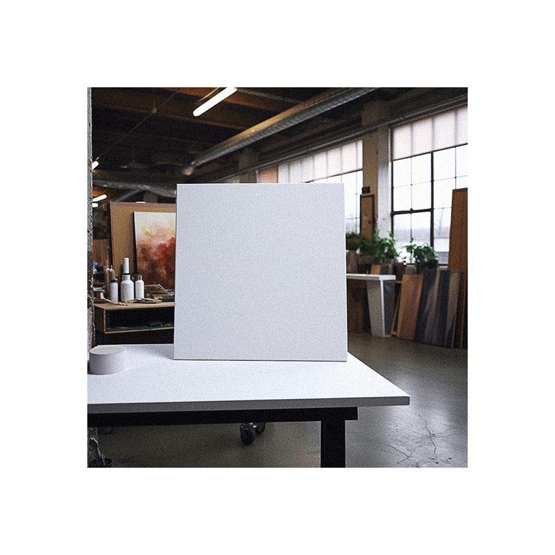 A white square sitting on a table in a studio.