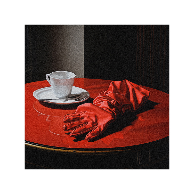 A red glove on a table.
