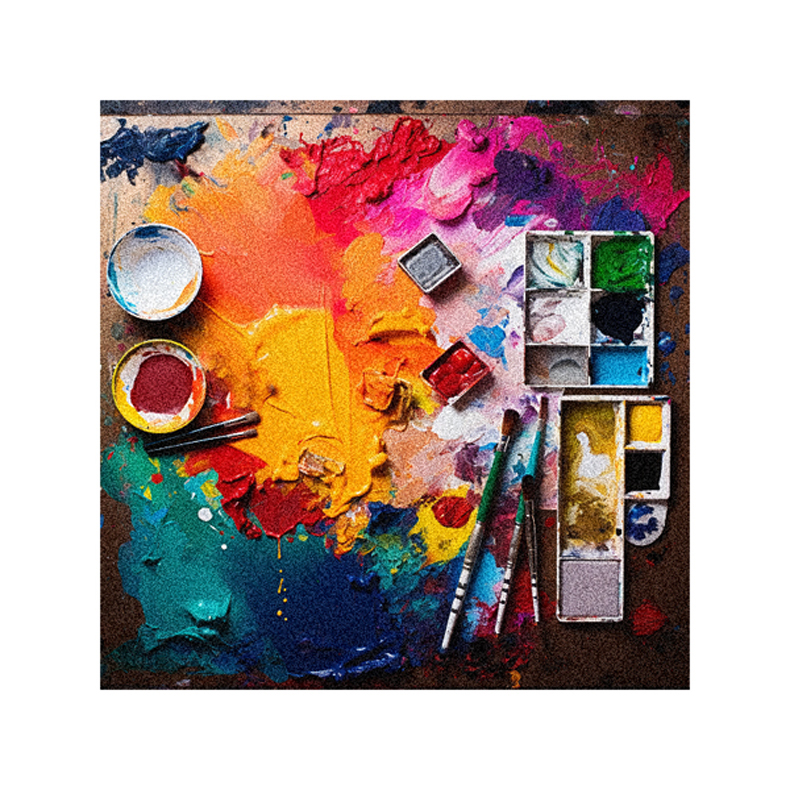 An artist's palette and paints on a table.