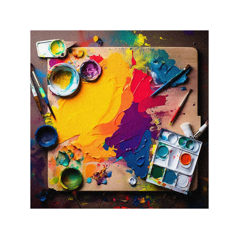 An artist's palette with paints and brushes on it.